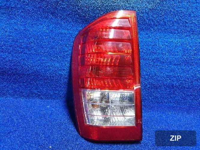 Kia Carnival 2010 — фонарь задний левый наружный 3