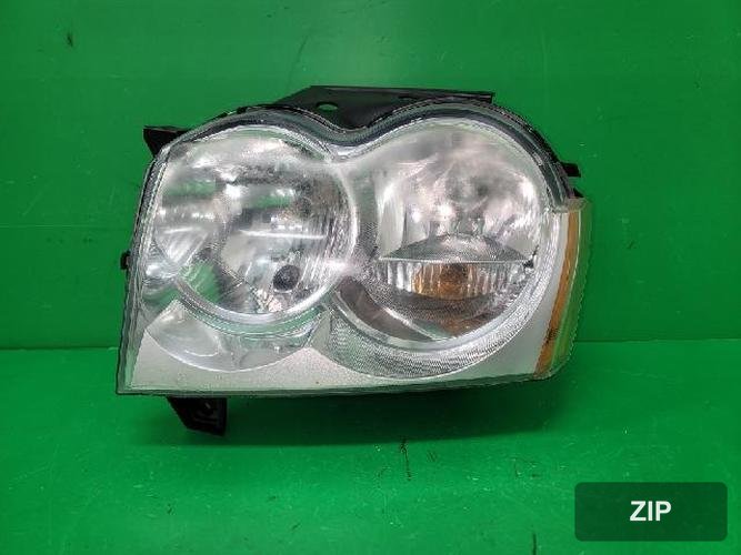 Jeep Grand Cherokee 2005 — фара левая 55156671AG