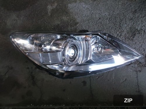Крышка фары передней HID 10pin правая 921043M030