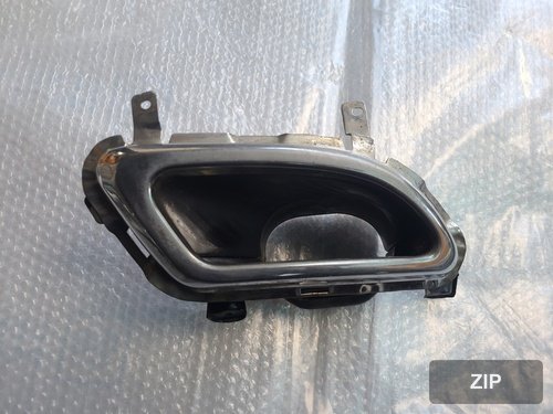 Rear bumper with muffler tip, passenger side